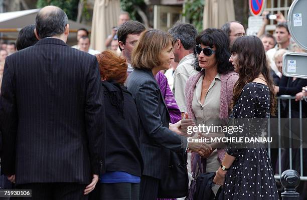 French Culture Minister Christinre Albanel comforts Nathalie Serrault and Gwendoline Courreges , daughter and grand-daughter of French actor Michel...