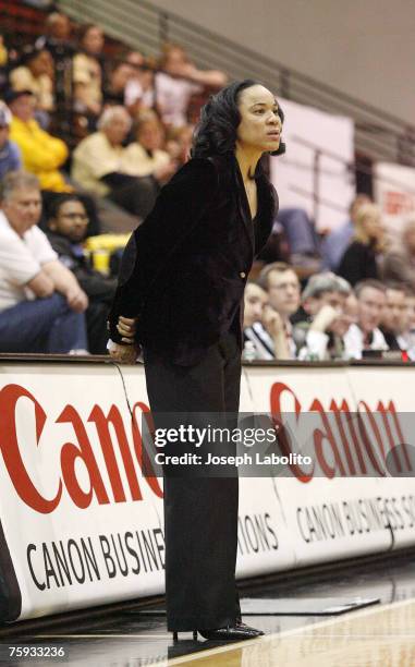 Head coach Dawn Staley cuts down the nets on her third consecutive A-10 title. The Temple Lady Owls defeated the George Washington Colonials 59 to 54...