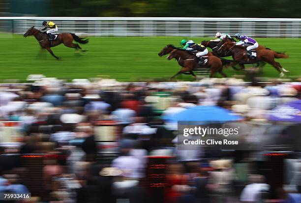 Ryan Moore on Moorhouse Lad takes the lead to win the Audi stakes run at Goodwood Racecourse on August 2 in Goodwood, England. Today is the third day...