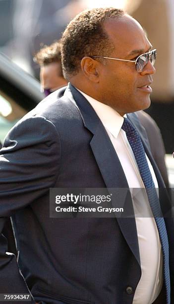 Simpson arrives at the memorial service for Johnnie Cochran at West Angeles Cathederal in Los Angeles, California April 6, 2005