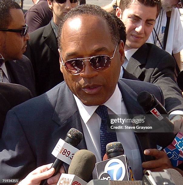 Simpson arrives at the memorial service for Johnnie Cochran at West Angeles Cathederal in Los Angeles, California April 6, 2005