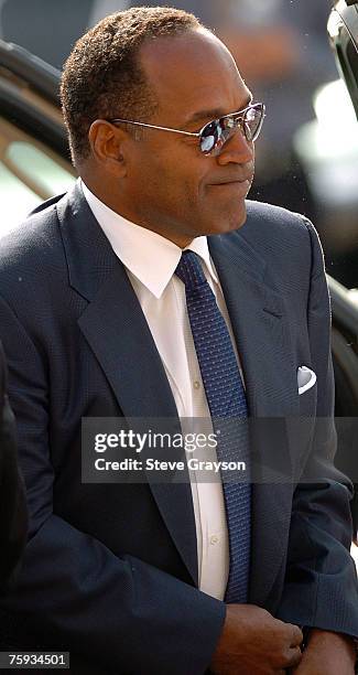 Simpson arrives at the memorial service for Johnnie Cochran at West Angeles Cathederal in Los Angeles, California April 6, 2005