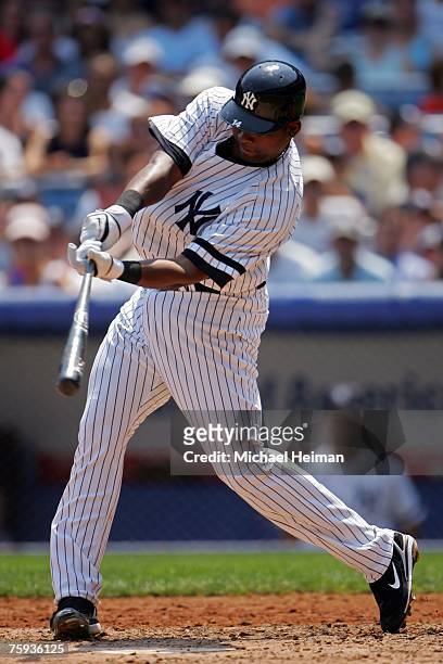 Wilson Betemit of the New York Yankees hits a three-run home run in the second inning against the Chicago White Sox at Yankee Stadium on August 2,...