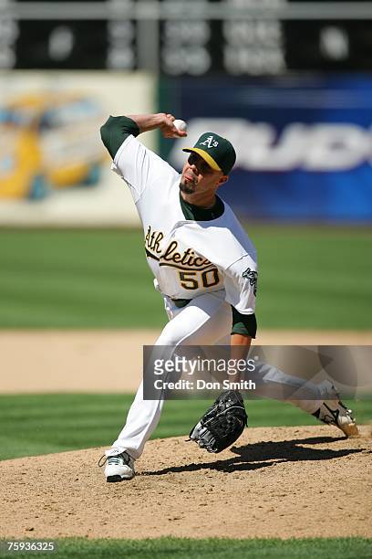 Kiko Calero of the Oakland Athletics pitches during the game against the Baltimore Orioles at the McAfee Coliseum in Oakland, California on July 22,...