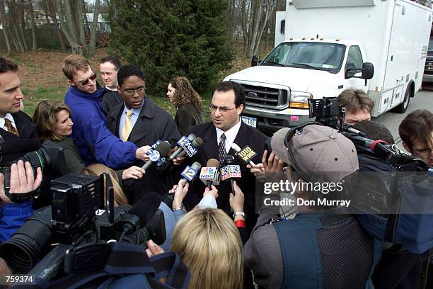 Dover Township Deputy Mayor Carmine Inteso, Jr. Briefs the news media at the scene where 5 people were shot to death April 10, 2002 in Toms River,...