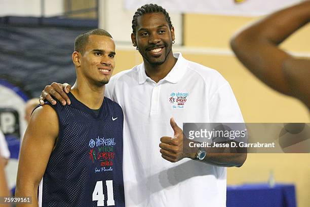 Nene of the Denver Nuggets poses with a young player from Puerto Rico during Basketball Without Borders at the Pinheiros Sports Club on August 2,...