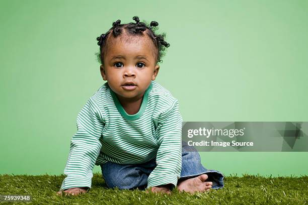 baby sitting on grass - baby studio bildbanksfoton och bilder