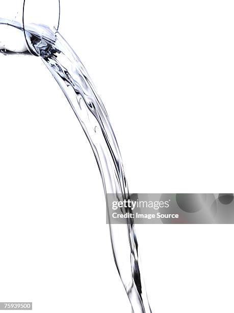 pouring water - transbordar imagens e fotografias de stock