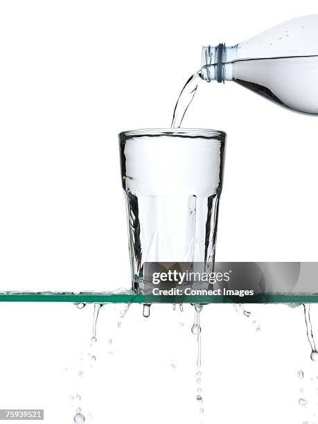 pouring water - overflowing stock pictures, royalty-free photos & images