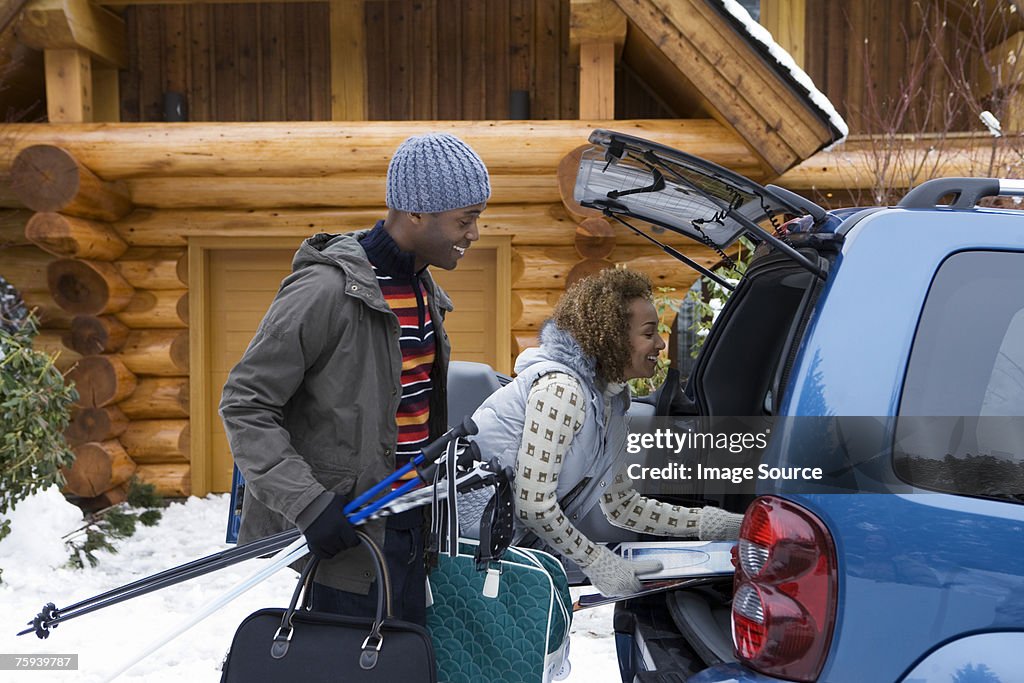 Couple packing car boot