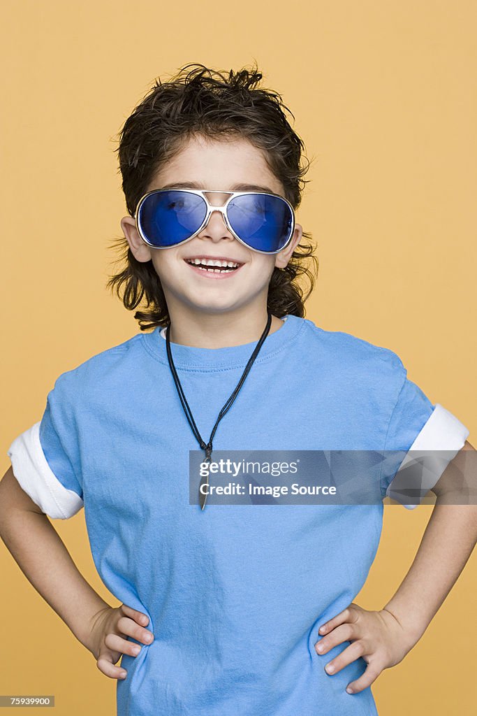 Boy wearing large sunglasses