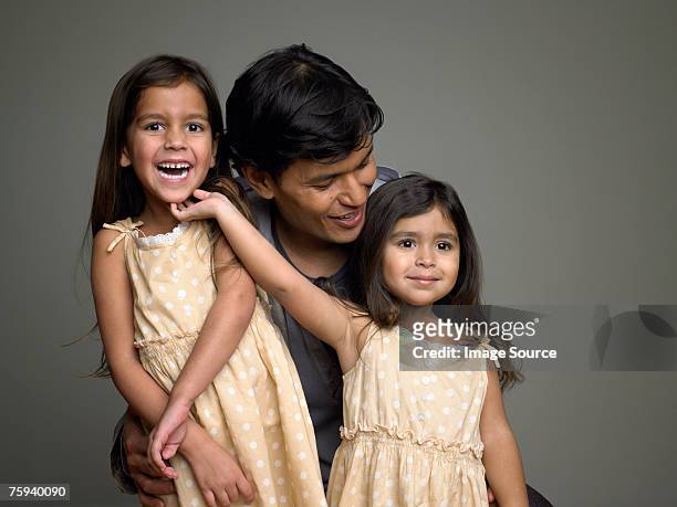 father and daughters - family portrait studio stock pictures, royalty-free photos & images