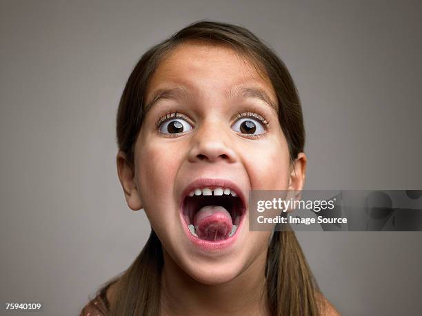 girl sticking out tongue - expressive eyes bildbanksfoton och bilder