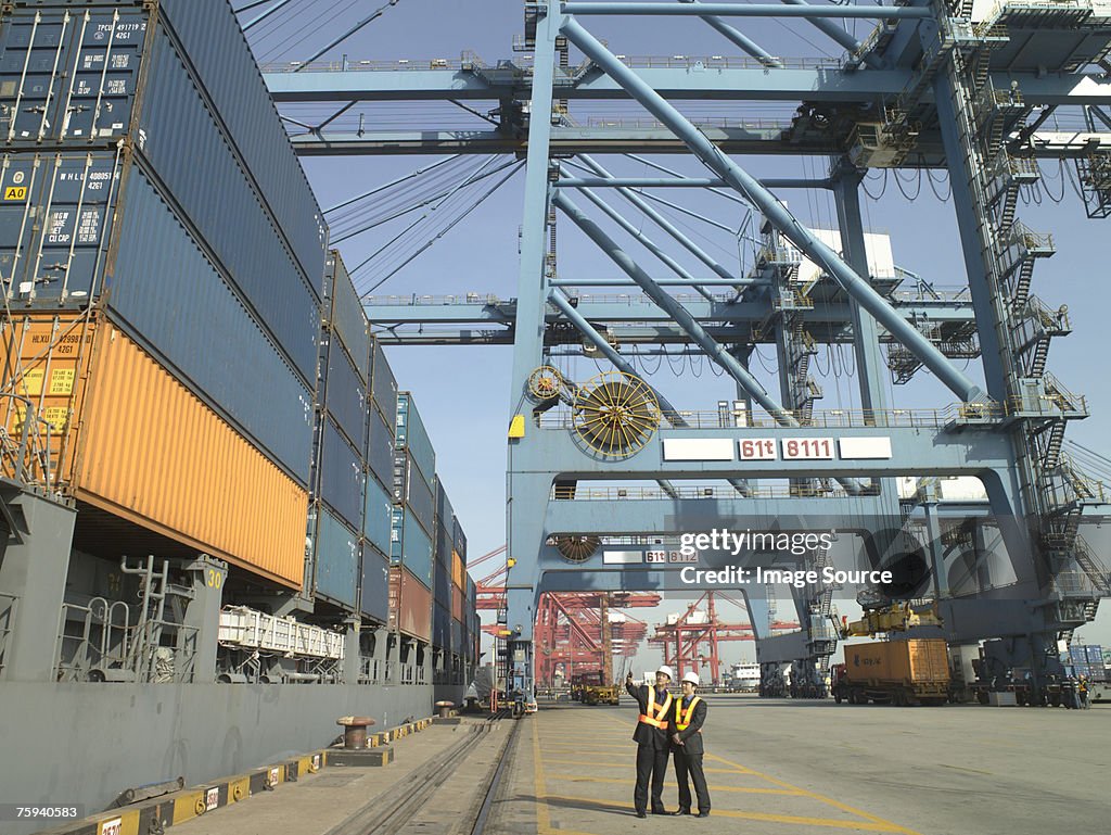 Men at container terminal