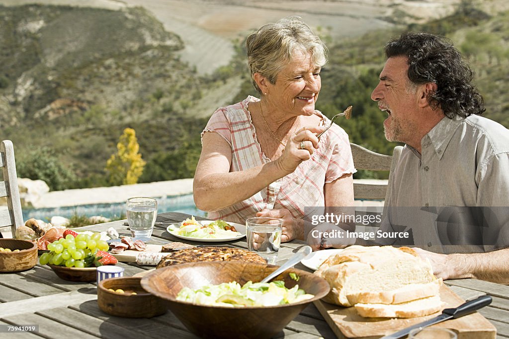 Couple having al fresco meal