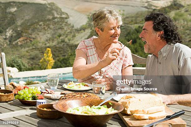 couple having al fresco meal - mediterranean food stock pictures, royalty-free photos & images