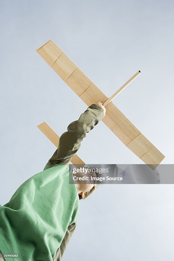 Boy with toy aeroplane