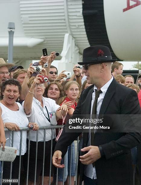 Actor Bruce Willis greets with fans before his show with his band during a Netflix Live on Location presentation at the Kennedy Space Center Visitor...