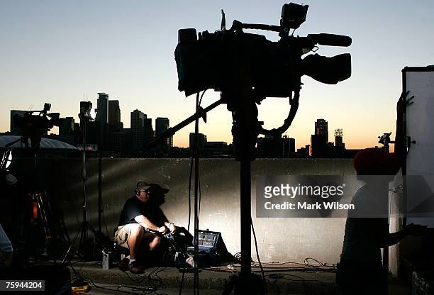 Members of the media work near the I-35W bridge that collapsed August 2, 2007 in Minneapolis, Minnesota. Yesterday, the eight lane steel and concrete...