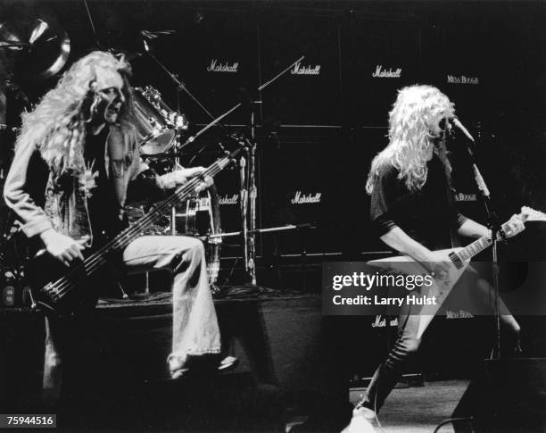 Original bassist Cliff Burton and singer and guitarist James Hetfield of the heavy metal quartet Metallica perform onstage in 1981.
