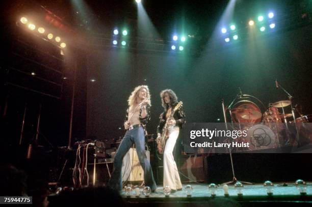 Singer Robert Plant and guitarist Jimmy Page of the rock band "Led Zeppelin" perform onstage at the Forum on June 26, 1977 in Los Angeles, California.