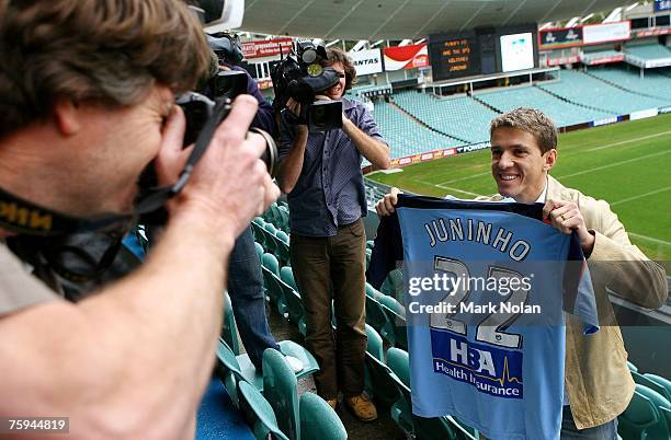 Juninho Paulista poses for photos during the press conference to announce the signing of Juninho Paulista with Sydney FC at Aussie Stadium on August...