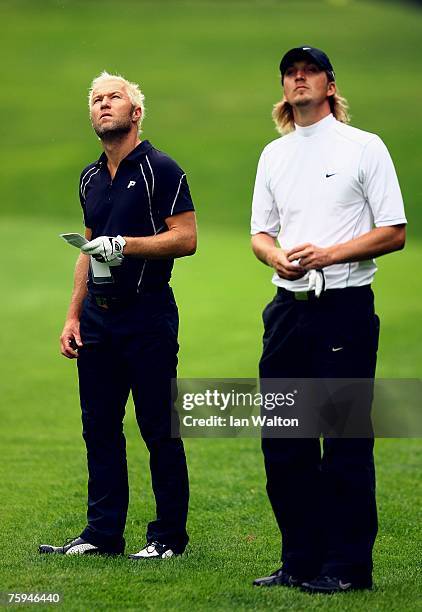 Per-Ulrik Johansson and Christopher Hanell of Sweden looks on during the second round of the Russian Open Golf Championship at the Moscow Country...