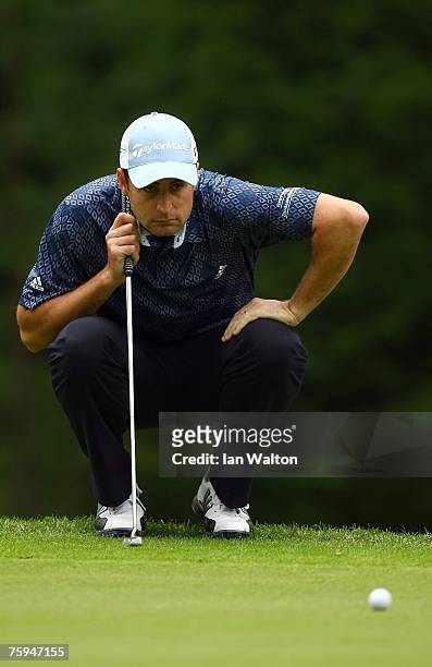 Richard Bland of England lines up a put on the 9th green during the second round of the Russian Open Golf Championship at the Moscow Country Club...