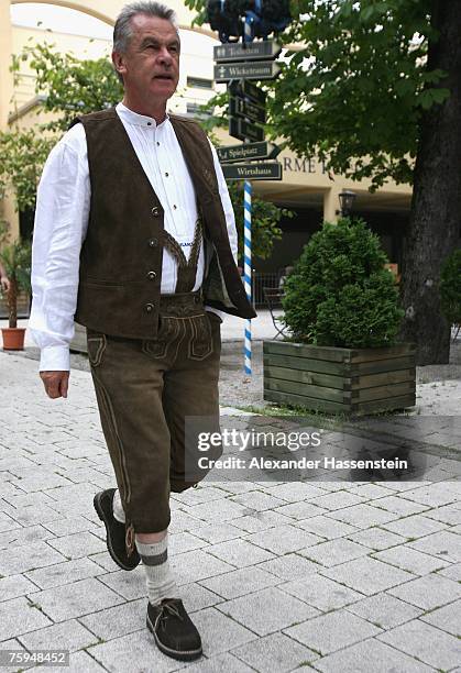 Munichs head coach Ottmar Hitzfeld walks through the Paulaner Biergarten after the Bayern Munich team sponsor photocall at the Nockherberg on August...