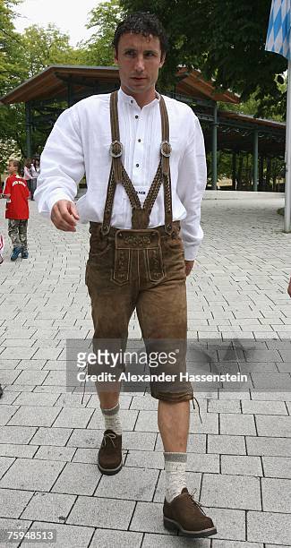 Mark van Bommel walks through the Paulaner Biergarten after the Bayern Munich team sponsor photocall at the Nockherberg on August 03, 2007 in Munich,...
