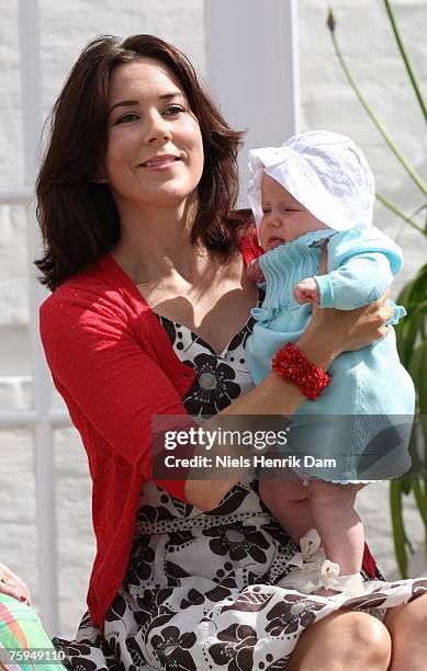 Princess Mary of Denmark poses with her daughter Princess Isabella at a photocall for the Royal Danish family at their summer residence of Grasten...