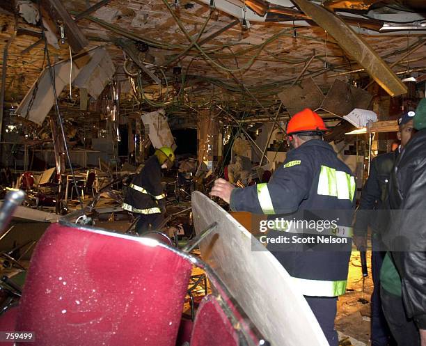 Israeli emergency workers search through the bombed out interior of the Park Hotel March 27, 2002 in Netanya, Israel. A Palestinian suicide bombing...