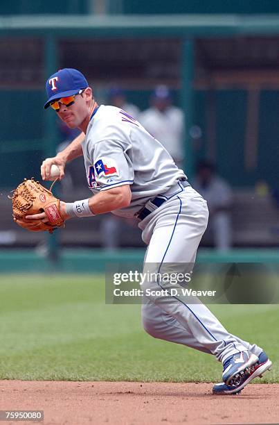 Michael Young of the Texas Rangers throws to first base against the Kansas City Royals at Kauffman Stadium in Kansas City, Missouri on July 29, 2007....