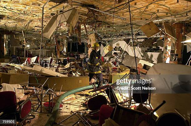 Israeli emergency workers search through the bombed out interior of the Park Hotel March 27, 2002 in Netanya, Israel. A Palestinian suicide bombing...
