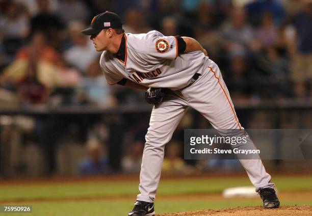 Noah Lowry of the San Francisco Giants delivers a pitch during their contest against the Arizona Diamondbacks at Bank One Ballpark in Phoenix,...