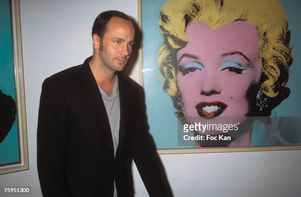 Tom Ford posing front of a Marilyn Monroe by Andy Warhol at the Georges Pompidou Museum, Paris - March 2001
