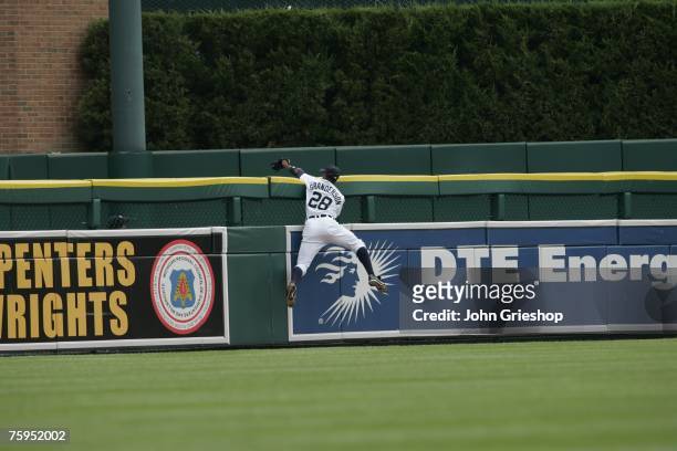 Curtis Granderson of the Detroit Tigers tracks down ball during the game against the Boston Red Sox at Comerica Park in Detroit, Michigan on July 8,...