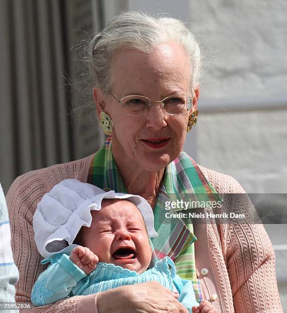 Queen Margrethe II of Denmark poses with Princess Isabella of Denmark at a photocall for the Royal Danish family at their summer residence of Grasten...