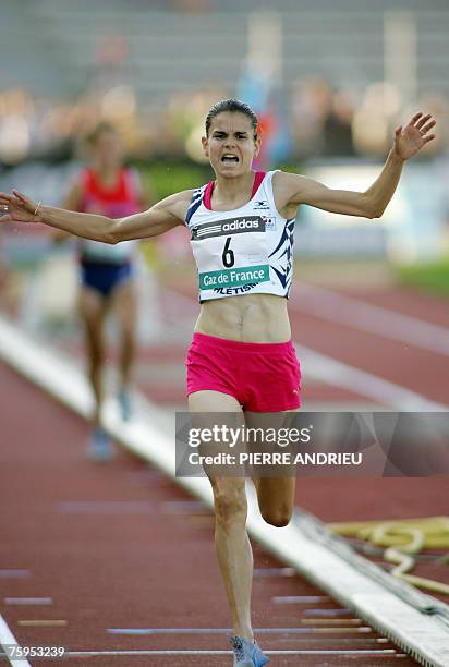 Sophie Duarte raises her arms as she wins the women's 3000m Steeplechase, during the French athletics championship in Niort, held from 03 to 05...