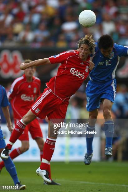 Fernando Torres of Liverpool challenged by Li Wei Feng during the Port of Rotterdam Tournament match between Liverpool and Shanghai Shenhua FC at the...