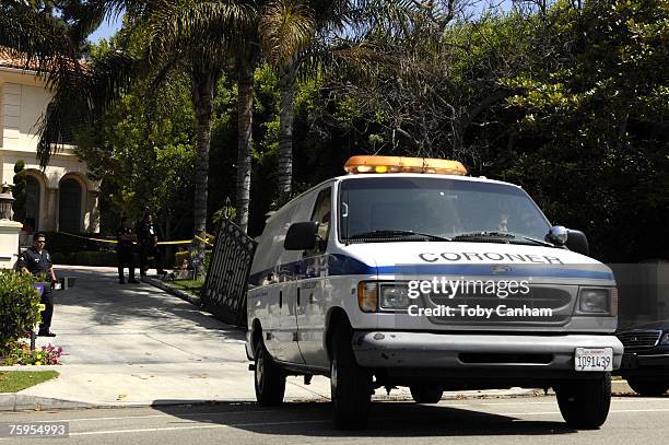 Officers attend to the scene at the home of actor Ving Rhames as the coroner van leaves on August 3, 2007 in Brentwood California. According to...