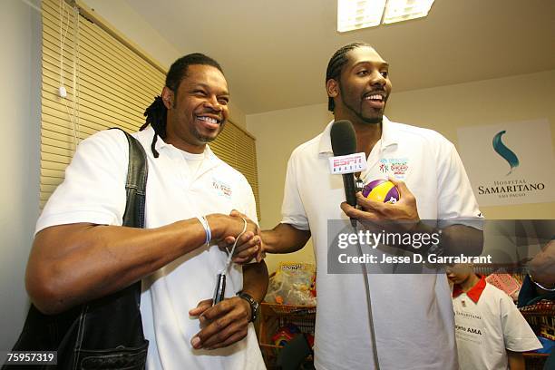 Nene of the Denver Nuggets interviews Sam Perkins former NBA player for ESPN Brazil during Basketball Without Borders on August 3, 2007 in Sao Paulo,...