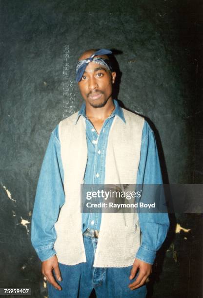 Rapper Tupac Shakur poses for photos backstage after his performance at the Regal Theater in Chicago, Illinois in March 1994.