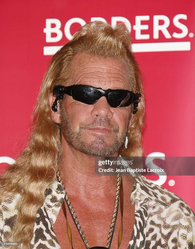 Duane Chapman aka "Dog The Bounty Hunter" signs his memoir, "You Can