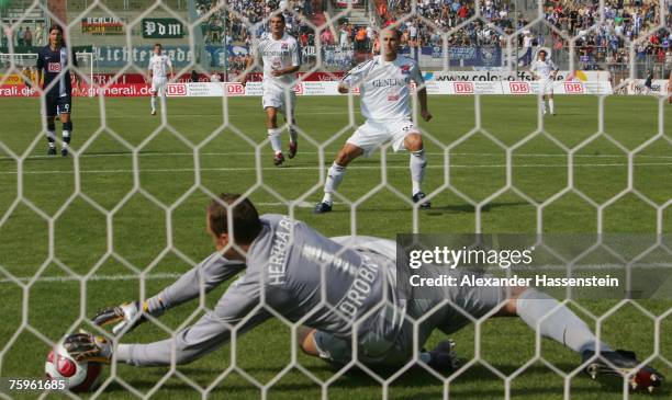 Berlin?s keeper Jaroslav Drobny saves a penalty shot by Robert Lechleitner of Unterhaching during the German Football Association Cup first round...