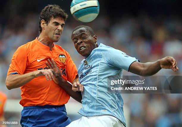 Manchester City's Nedum Onuoha vies with Valencia's Jaime Gavilan during their pre-season Thomas Cook Trophy football match at The City of Manchester...