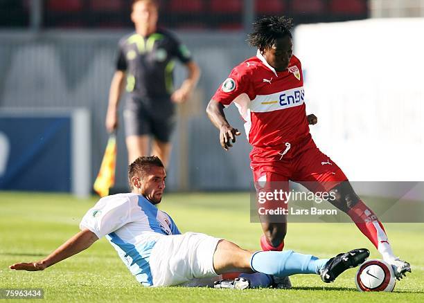 Dajan Simac of Wehen tackles Arthur Boka of Stuttgart during the German Football Association Cup first round match between SV Wehen-Wiesbaden and VfB...