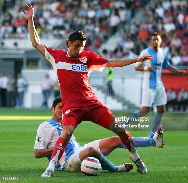 This tackle of Vlado Jeknic of Wehen against Ciprian Marica of Stuttgart causes a penalty during the German Football Association Cup first round...