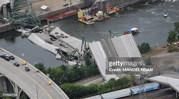 An aerial view shows the collapsed I-35W bridge 04 August 2007 in Minneapolis, Minnesota. Five people have been confirmed dead and 8 others missing...