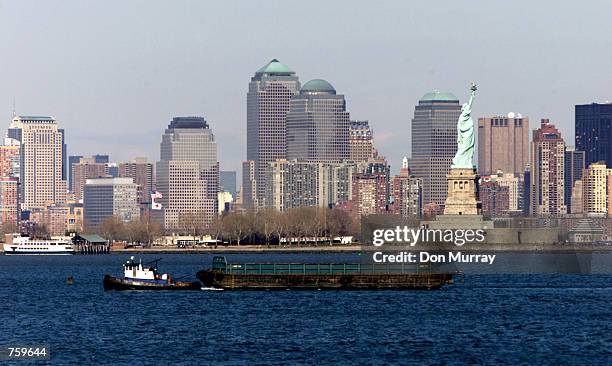 Barge is towed March 27, 2002 through New York Harbor, NY. A group of government and industry officials met to discuss the ports of New York and New...